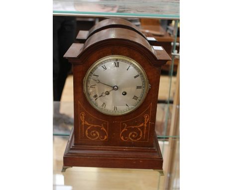 An Edwardian mahogany bracket clock, having an eight day movement, a silvered dial and Roman numerals, two winder holes, stri
