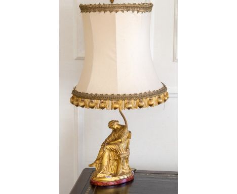 A French ormolu figural table lamp, late 19th Century, modelled as a neoclassical maiden in flowing robes seated in a chair a