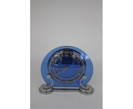 An Art Deco Smiths mantel clock, blue glass face, chrome base, circa 1930's, spring driven movement, Pat 445969, 20cms high a