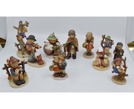 A collection of Goebel figures of children including Boy with Rabbits; Busker etc (af)&nbsp;