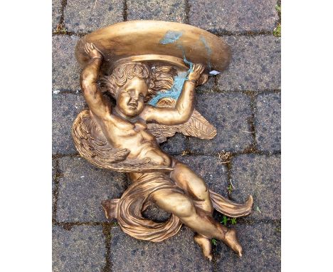 &nbsp;A modern composite decorative figural bracket, modelled as a putto supporting a half moon stand, 47cm.