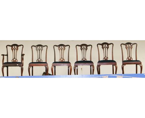 A George V set of six mahogany dining chairs, circa 1920, in the manner of Thomas Chippendale, comprising a pair of carver ch