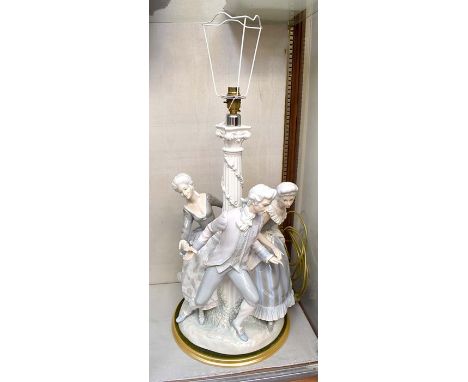 A large Lladro figural table lamp, modelled as 18th Century style ladies and a gallant engaged in a tryst beside a Corinthian