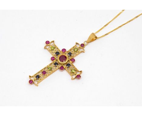 A 9ct gold ruby, sapphire and peridot set cross, ornate open filigree style decoration, collet set with round cut stones, len