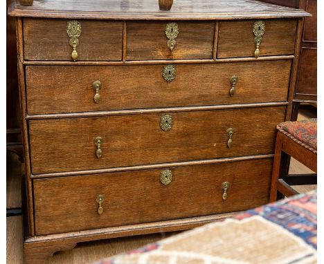 An 18th Century oak and cross banded chest of drawers, the moulded cross-banded top above three short and three long graduate