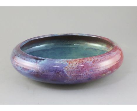 A Royal Doulton Titanian ware flambe bowl, c.1910, of compressed globular form, inspired by Chinese Jun ware glazes, black pr