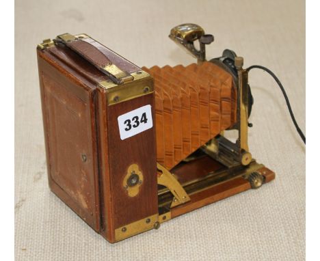 A Compur Tropical cased camera with Dialytar lens and gilt brass mounted teak case, height 18cm, depth when closed 6cm, lengt