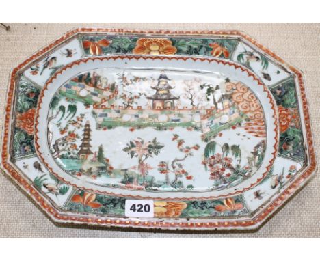 An 18th century Chinese famille verte octagonal meat plate, decorated with pagodas in a garden, flowers and birds, 36 x 26cm 