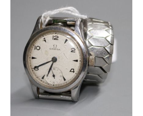 A gentleman's early 1940's stainless steel mid-size Omega manual wind wrist watch, on associated bracelet. Condition: No box 