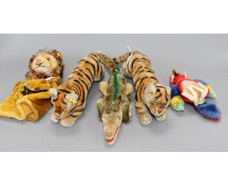 Two 1950's Steiff tigers, a crocodile, a parrot and a lion glove puppet Condition:- first tiger - a little faded, ears worn, 