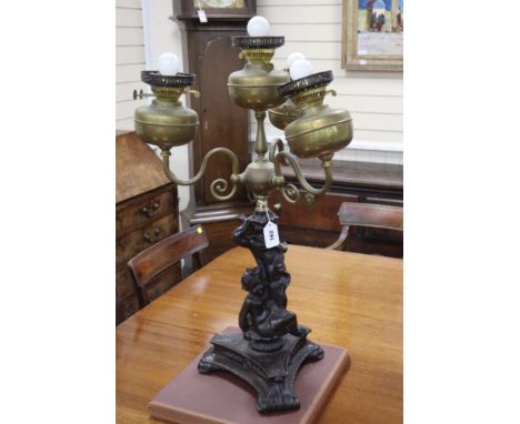 An Edwardian brass mounted bronzed spelter four light table lamp, c.1900, height 76cm Condition: Lacking shades, has been fit