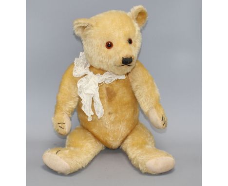 A Chiltern type bear, blond mohair, glass eyes, original pads, some slight staining on centre seam otherwise good condition