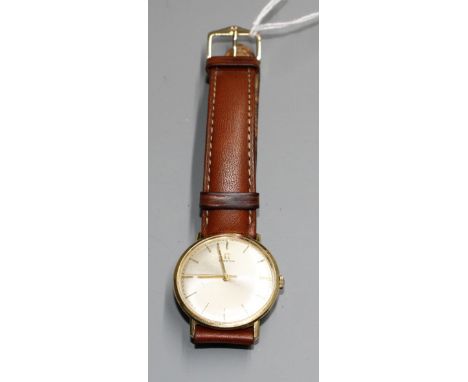 A gentleman's Omega manual wind wrist watch, on associated strap, with yellow metal? case.Condition: Unable to remove case ba