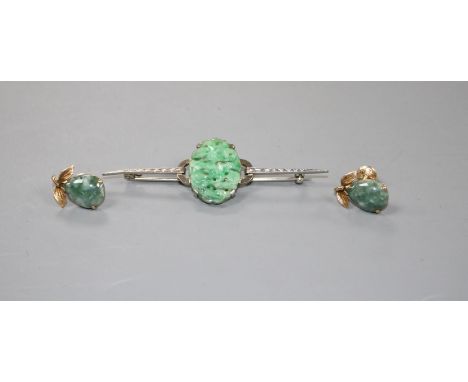 A 9ct white metal and carved oval jade plaque set bar brooch and a pair of 14k and simulated jade earrings, bar brooch 64mm.C