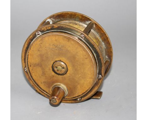 An early brass 4.5in. fishing reel by Army &amp; Navy Cooperative Stores Ltd., engraved mark, diameter 11.5in., with horn han