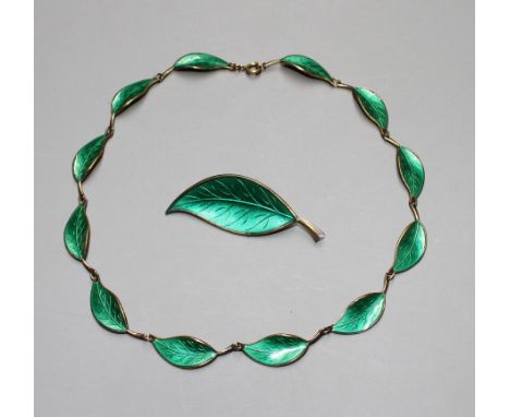 A Norwegian David Andersen 925S and green enamel leaf necklace and one other leaf brooch. Condition:Necklace- The gilding on 