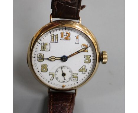 A gentleman's 1920's 9ct. gold manual wind wristwatch, with case back inscription. Condition: A few small dents to the case b