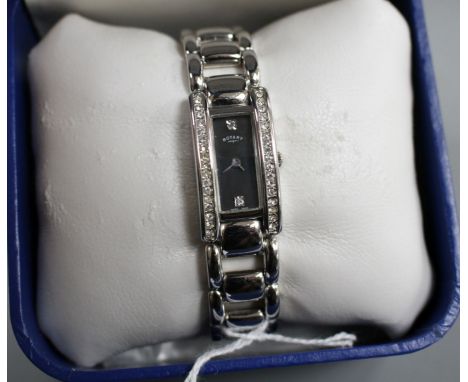 A lady's modern steel and paste set Rotary quartz dress wrist watch, with box and spare links. Condition: Watch in generally 