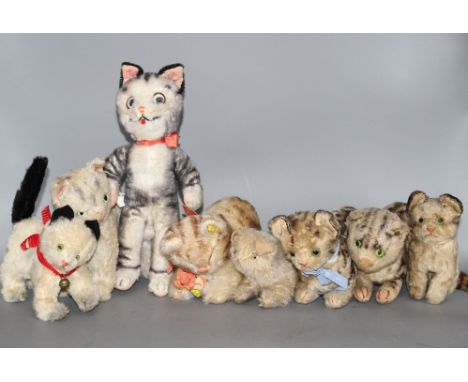 A group of assorted vintage soft toy cats including Steiff Condition:- Steiff? black velvet cat with raised fluffy tail, fade