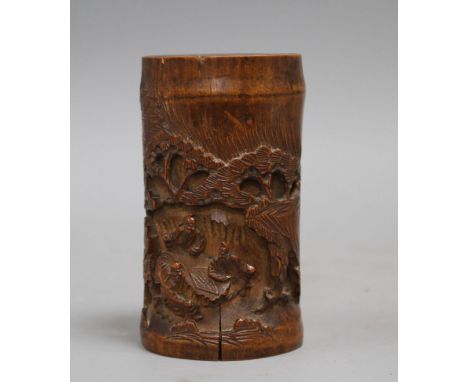 A Chinese bamboo brush pot, carved with scholars playing weiqi, late 19th/early 20th century some age splits to the bamboo an