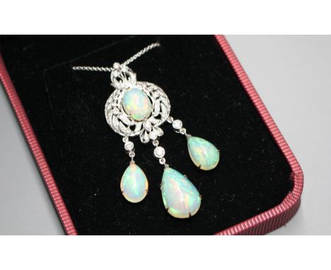 A modern 18ct white gold, diamond and white opal set drop pendant by Luke Stockley, on an Italian 750 white metal chain, pend
