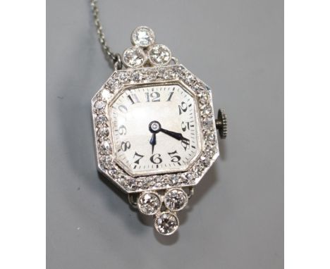 A lady's platinum and diamond set manual wind wrist watch (no strap) now with brooch fitting, 33mmCondition: Four of the smal