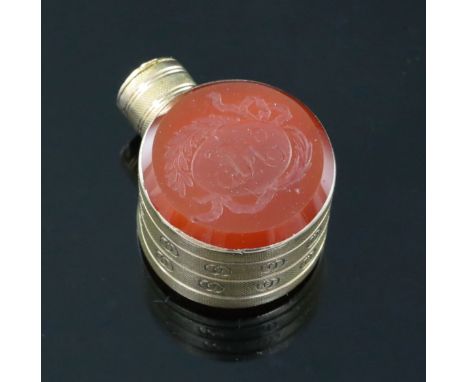 A small 19th century engraved gold and carnelian set moon shaped scent flask, one carnelian carved with initials in oval cart