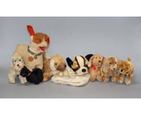 Eight assorted vintage soft toy dogs including Steiff Condition:- 1950's Bully glove puppet - a little dirty and slightly fad