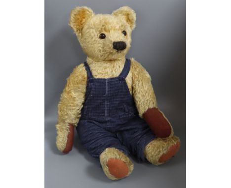 A large Chad Valley 1950's bear, in blue dungarees, 27in., good condition with new paw pads