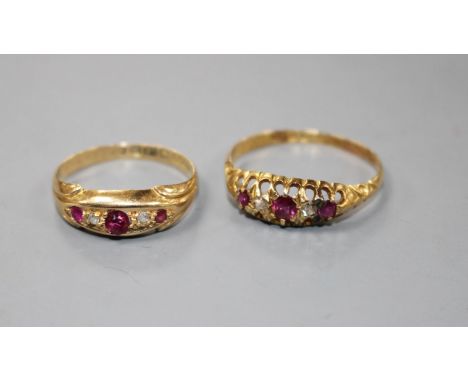 Two early 20th century 18ct gold, ruby and diamond set dress rings, sizes- N(3 stone) and R. Gross weight 4.4 grams.Condition