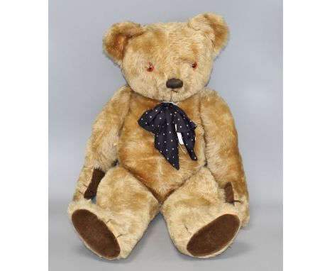 A 1950's Chad Valley bear, 26in., arm label, velvet pads