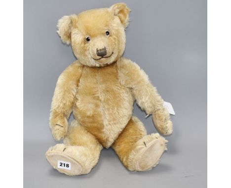 A Chiltern Hugmee bear c.1930's, 19in., blond mohair, good condition, glass eyes and velvet pads