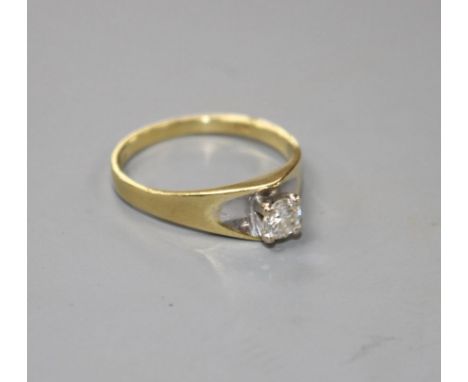 A modern 18ct gold and solitaire diamond ring, size L/M, gross weight 2.6 grams.Condition- Mildly used condition, with no vis