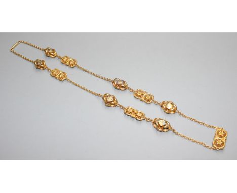 An antique pinchbeck and three colour enamel necklace, with pierced scroll links, 80cmCondition: Some loss to the enamel in g