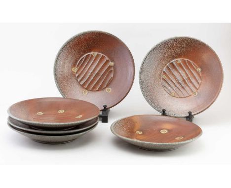 † PHIL ROGERS (1951-2020); a set of six salt glazed dinner plates with impressed shell decoration, impressed PR marks, diamet