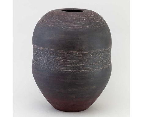 † CHRIS CARTER (born 1945); a large stoneware waisted jar covered in bronze glaze with incised decoration, impressed CCP mark