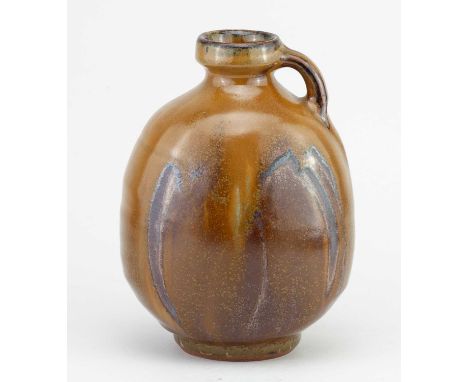 † MIKE DODD (born 1943); a flattened stoneware bottle with side handle partially covered in mustard river iron glaze with fin