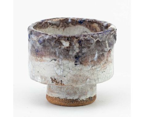 † ROBIN WELCH (1936-2019); a stoneware bowl covered in white crackle glaze with textured lilac rim and enamel decoration, dia