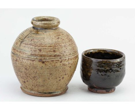† TREVOR CORSER (1938-2015) for Leach Pottery; a globular stoneware bottle covered in mottled green ash glaze with combed dec