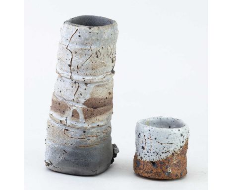 † SEBASTIAN BLACKIE (born 1949); a stack of three stoneware teabowls, height 18cm, and a sake whisky schnapps cup, made 2004 