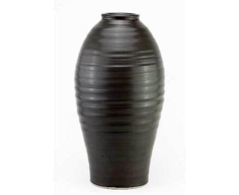 † CHRISTIANE GUENTHER for Made in Cley Craft Cooperative; a tall stoneware vase with pronounced ribbing covered in bronze gla