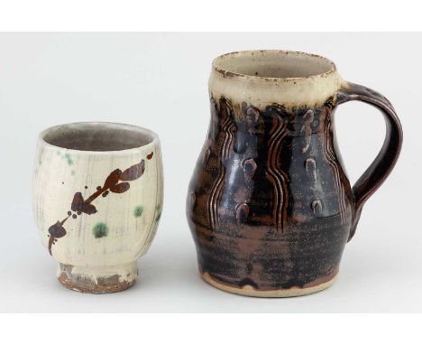 † JIM MALONE (born 1946); 'Millennium Mug', a stoneware mug covered in tenmoku breaking to kaki glaze with pale green ash rim