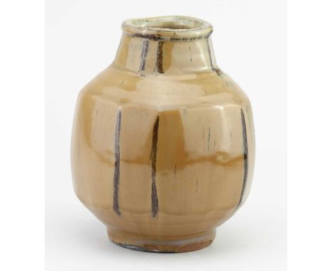 † MIKE DODD (born 1943); a faceted stoneware bottle covered in river iron over granite glaze, height 17cm.Condition Report: C