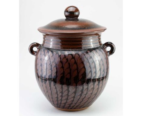 † DAVID LLOYD JONES (1928-1994); a large stoneware twin handled jar and cover with iron rich decoration on tenmoku glaze, imp