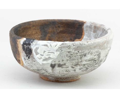 † ROBIN WELCH (1936-2019); a stoneware bowl covered in white and bronze glaze with enamel decoration, diameter 14cm.Condition