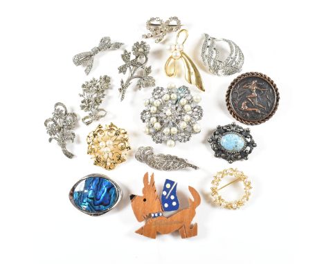 A collection of vintage and modern costume jewellery brooch pins. The brooches to include a wooden Scottie dog, simulated pea