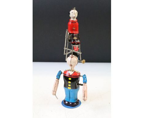 Mid 20th Century Marx Linemar lithographed tin plate clockwork model of Popeye and Olive Oyl, featuring Karl-Alfred 'Popeye' 