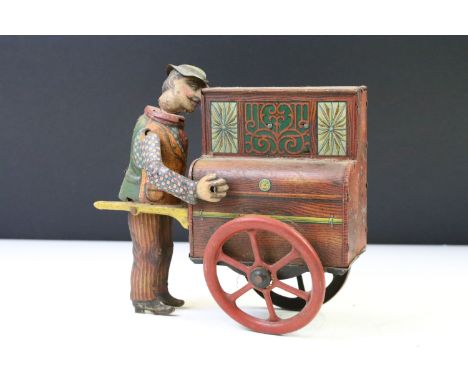 Early 20th Century Distler Jacko the Merry Organ Grinder German clockwork tinplate toy (Circa 1920's), with working musical m