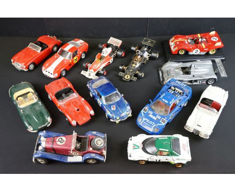 Collection of 13 unboxed 1/18 and 1/16 scale diecast models to include 2 x Corgi F1 Formula One cars featuring Mclaren M23B a