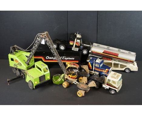 Collection of metal models to include Lumar Contractors green crane, Nylint Gasohol tanker, Auto Transport Car Trailer, Nylin